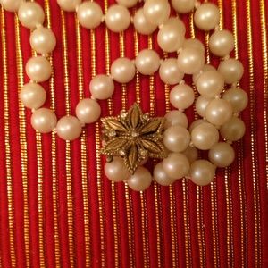 Beautiful Antique looking strand of Faux Pearls